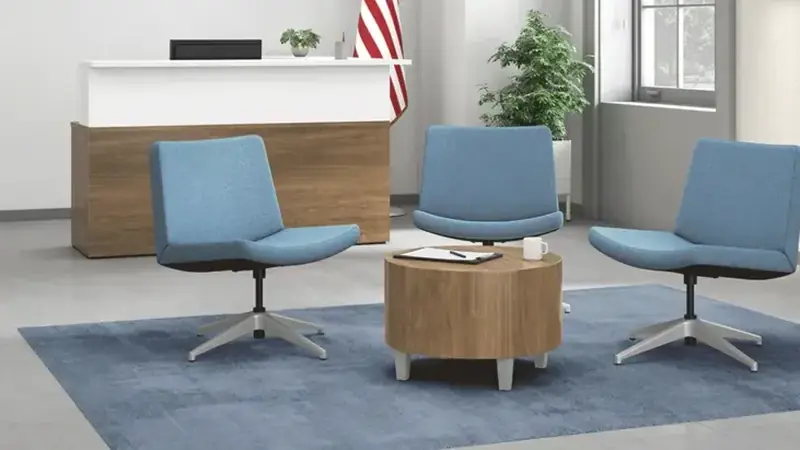 Government office lobby with a reception counter, lounge chairs and a round table